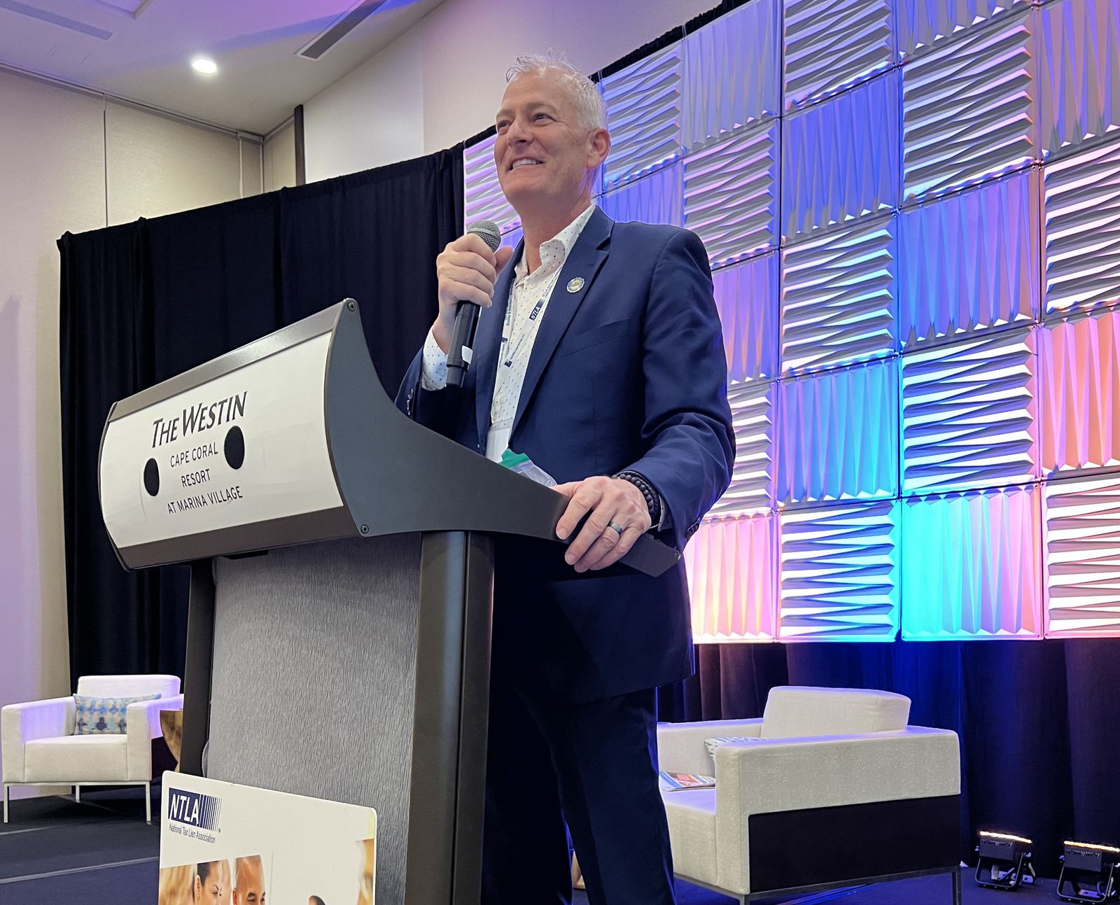 Brad Westover speaking on stage at the NTLA Annual Conference